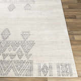 Close-up of Wakita Light Gray Tribal Rug showing its geometric, bohemian pattern and soft texture. Front