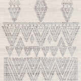 Close-up of Wakita Light Gray Tribal Rug. Bohemian style rug with charcoal and gray geometric pattern on off-white background. Swatch