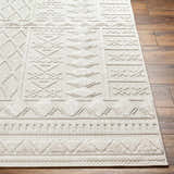 Close-up of the Elese Area Rug in beige and cream, showcasing its contemporary geometric pattern and textured details. Front
