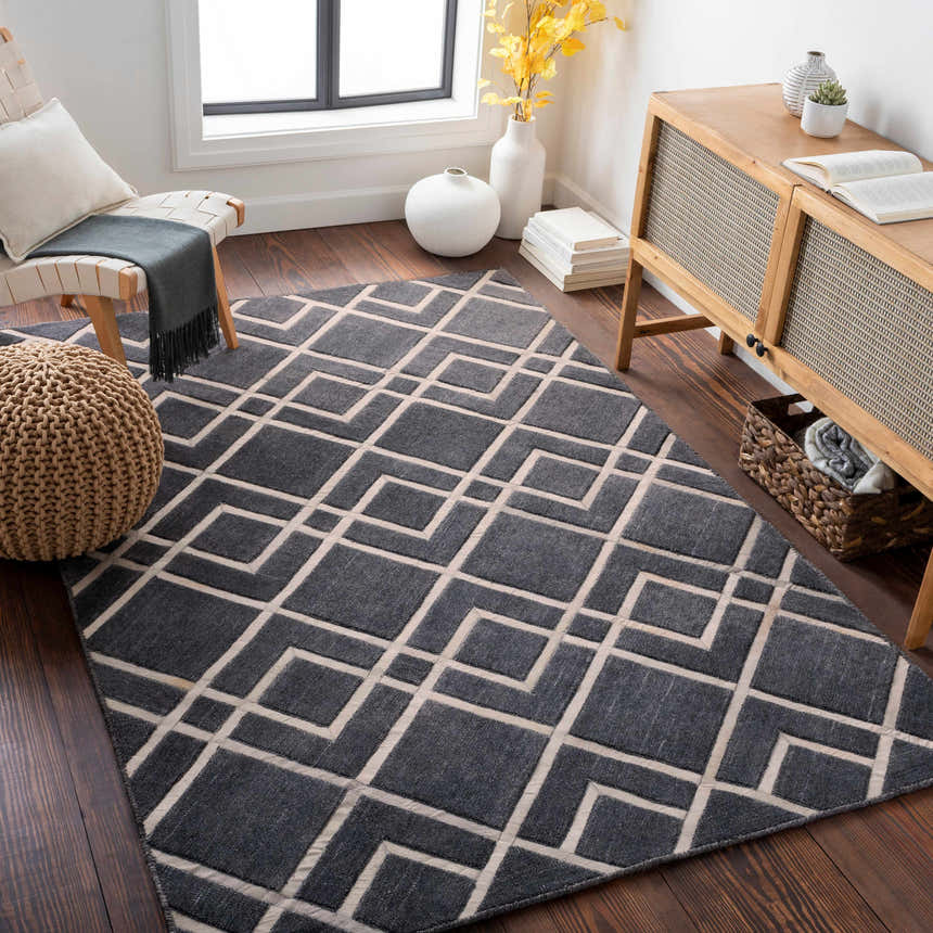 Living room scene with a gray and light gray Taclobo Area Rug featuring a geometric pattern. Mid-century modern decor. Roomscene-Rectangle