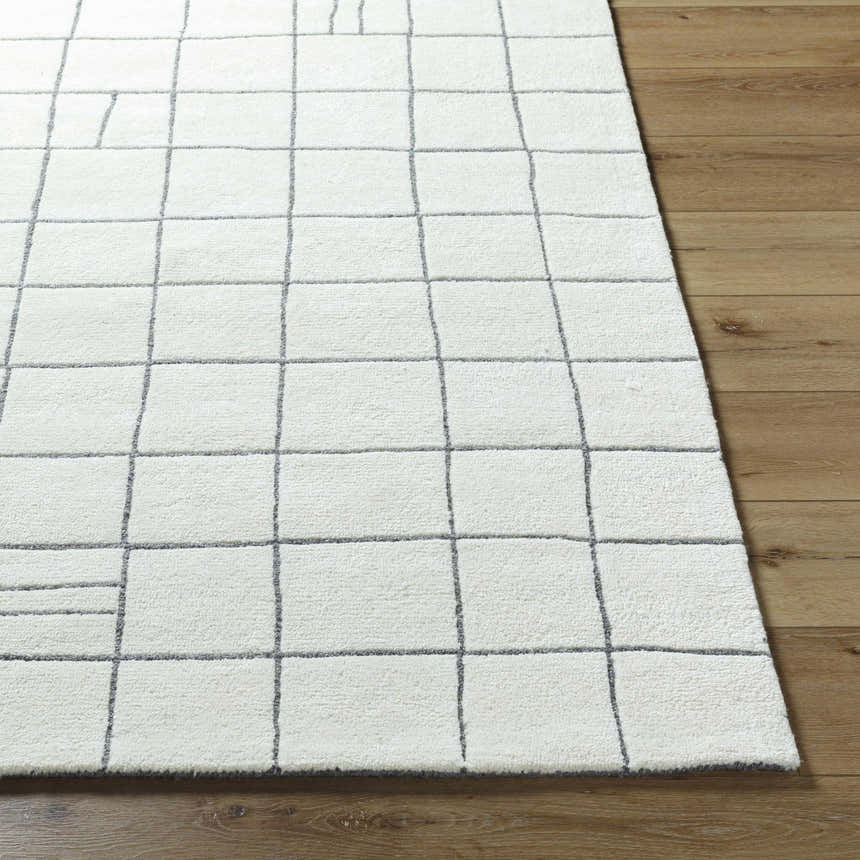 Close-up of the Tanya Pearl White Grid Wool Rug, featuring a geometric grid pattern on a soft, off-white wool texture. Front