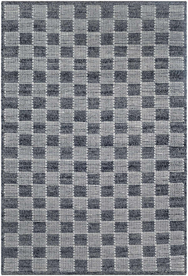 Close-up of the hand woven Thijs Area Rug. Charcoal and cream wool rug with a checkerboard pattern. Design-Rectangle-576