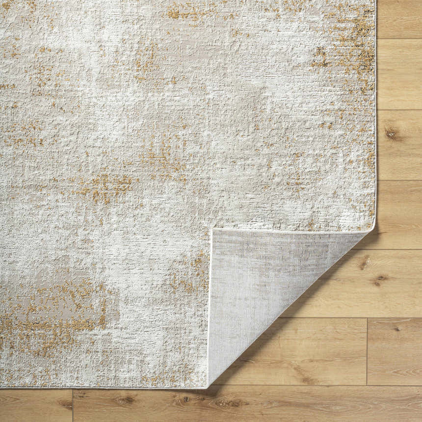 Close-up of the Tapko Tan Area Rug showing its abstract tan and cream pattern and machine-woven texture. Fold