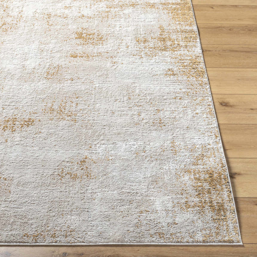 Close-up of the Tapko Tan Area Rug showing its distressed Southwestern design and soft polyester texture on wood floor. Front