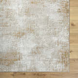 Close-up of the Tapko Tan Area Rug showing its distressed Southwestern design, neutral colors, and soft polyester texture. Corner
