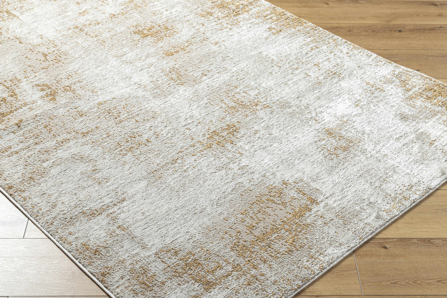 Close-up of Tapko Tan Area Rug showing its southwestern design, tan and cream colors, and soft texture. Corner