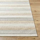 Close-up of the hand-tufted Touca Area Rug. Farmhouse style with ash, light silver, silver gray, and warm gray stripes. Front