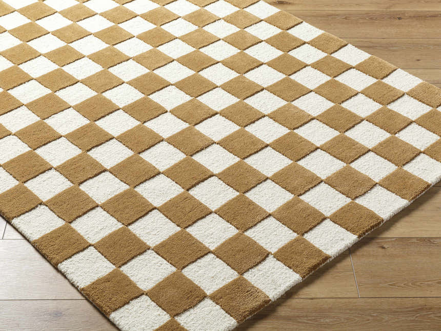 Close-up of the hand-tufted Timin Camel Checkered Area Rug, a contemporary wool rug with a cream and medium brown checkered pattern. Corner