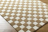 Close-up of the Timin Brown Checkered Wool Area Carpet. Cream and brown checkerboard pattern, hand-tufted texture. Corner