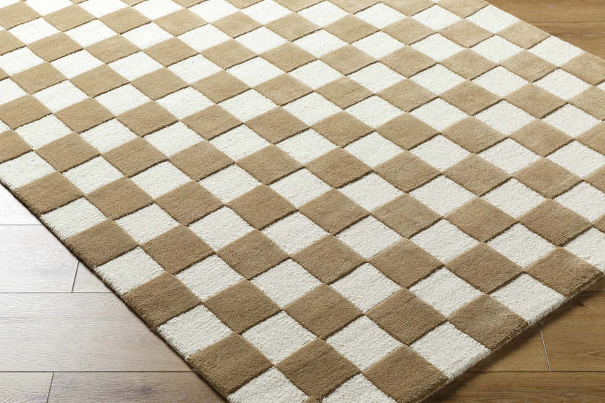 Close-up of the Timin Brown Checkered Wool Area Carpet. Cream and brown checkerboard pattern, hand-tufted texture. Corner