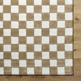 Close-up of the hand-tufted Timin Brown Checkered Wool Area Carpet. Cream and brown squares create a contemporary pattern. Corner