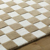 Close-up of the Timin Brown Checkered Wool Area Carpet showing cream and brown squares and textured wool. Texture