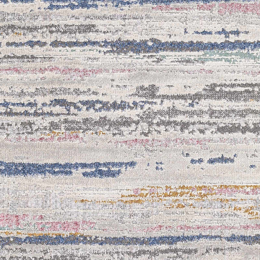 Close-up of Tekirova Striped Area Carpet. Contemporary design with blue, gray, pink, and gold stripes on a textured, neutral background. Swatch
