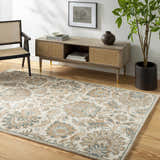 Living room scene with a beige Teom Area Rug, wood floors, console table, black chair, and potted plant. Roomscene-Rectangle
