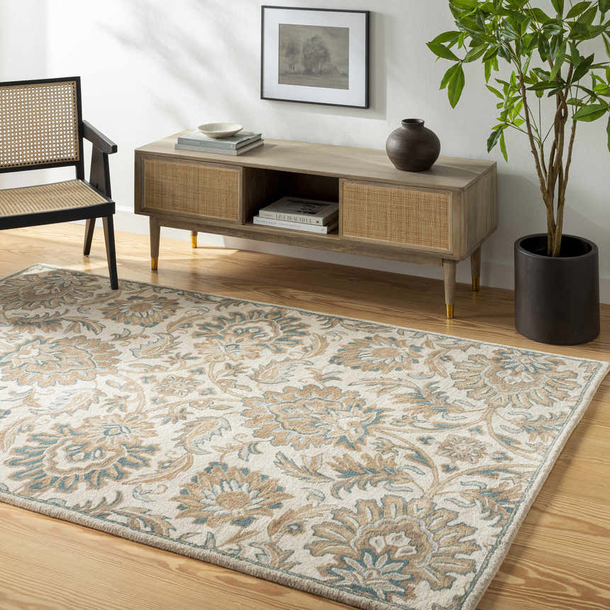Living room scene with a beige Teom Area Rug, wood floors, console table, black chair, and potted plant. Roomscene-Rectangle
