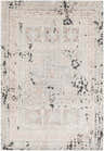 Close-up of the Terlingua Area Rug - Clearance, featuring a beige and light blue mosaic-style pattern with black distressing. Design-Rectangle-5373