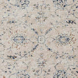 Close-up of the Ternate Area Rug, showcasing its cream base with brick red and navy blue traditional pattern. Swatch