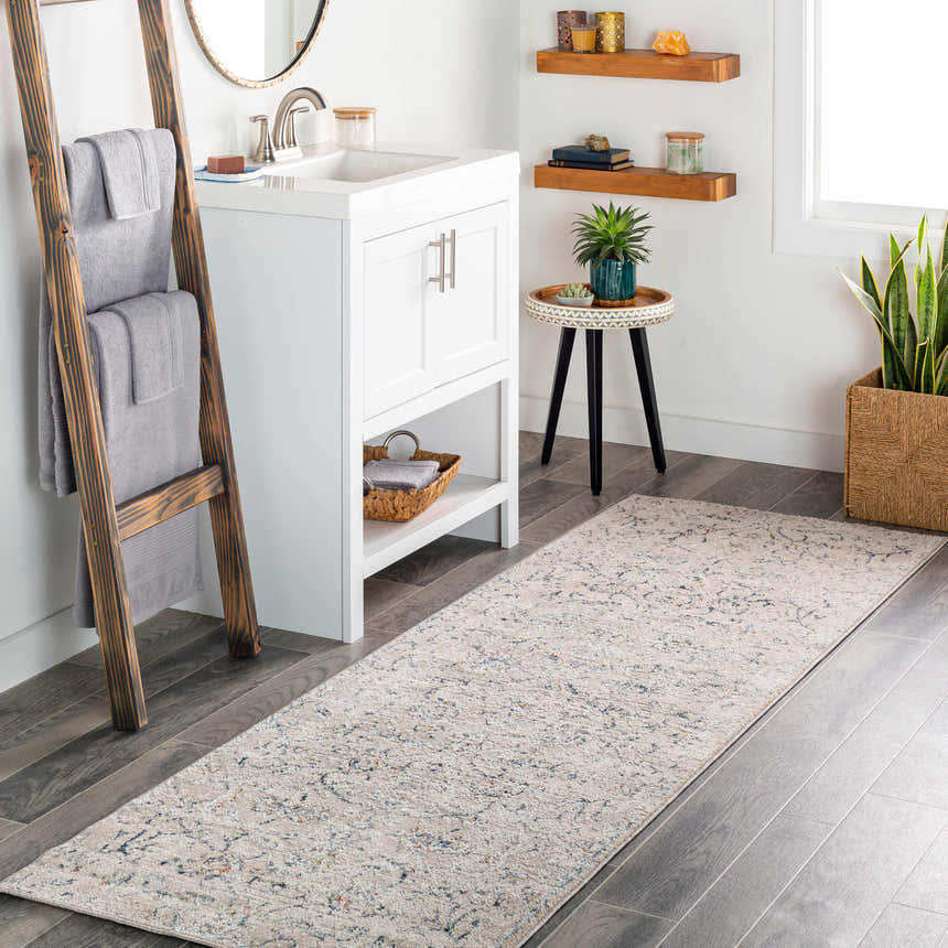 Bathroom scene with a cream Ternate Area Rug runner, white vanity, and rustic wood accents. Roomscene-Runner