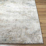 Close-up of the Twyla Thick Luxe Rug showing its beige, gray, and tan abstract design and plush texture on wood floors. Front
