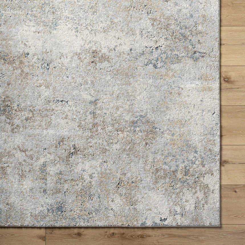 Close up of the Twyla Thick Luxe Rug showing beige, gray, and tan tones with a subtle contemporary pattern. Swatch