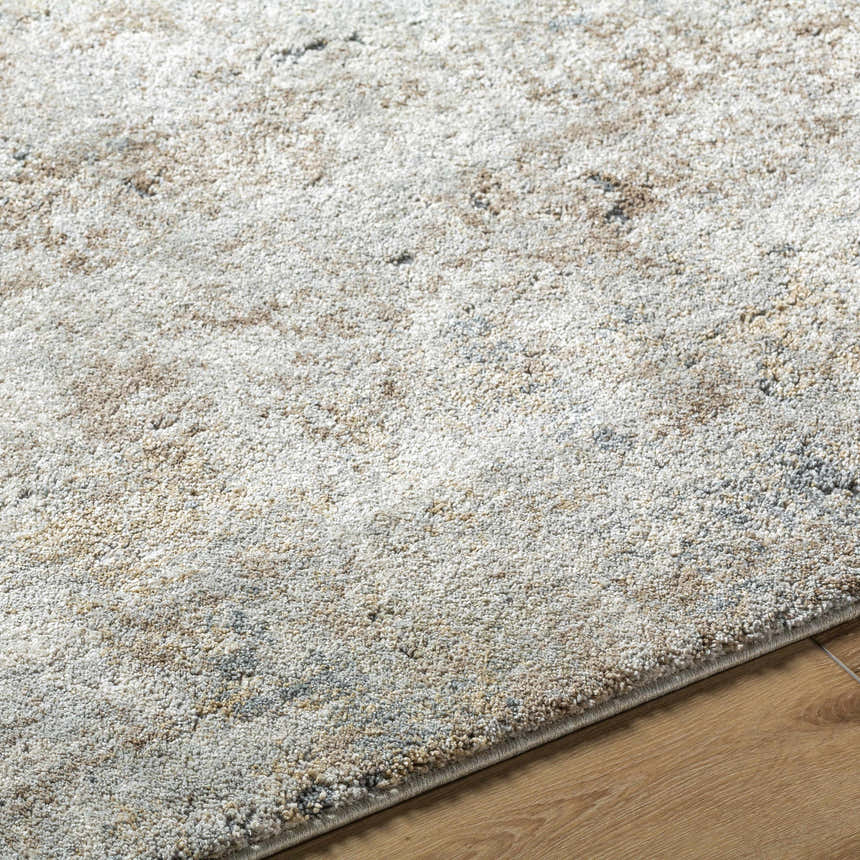 Close-up of the Twyla Thick Luxe Rug showing beige, gray, and tan tones and a soft, textured pile. Texture