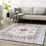 Living room scene with a Tigrim Beige 2306 Area Rug. The rug features a bohemian design with beige, ivory, and navy colors. Roomscene-Rectangle