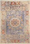 Detailed view of the hand-knotted Timnath Clearance Rug. Contemporary design in cream, blue, and rust colors. Wool rug texture. Design-Rectangle