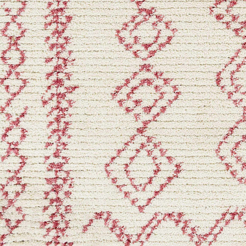 Close-up of the Tinawagan Area Rug: a cream rug with a textured, geometric diamond pattern in a soft red hue. Swatch
