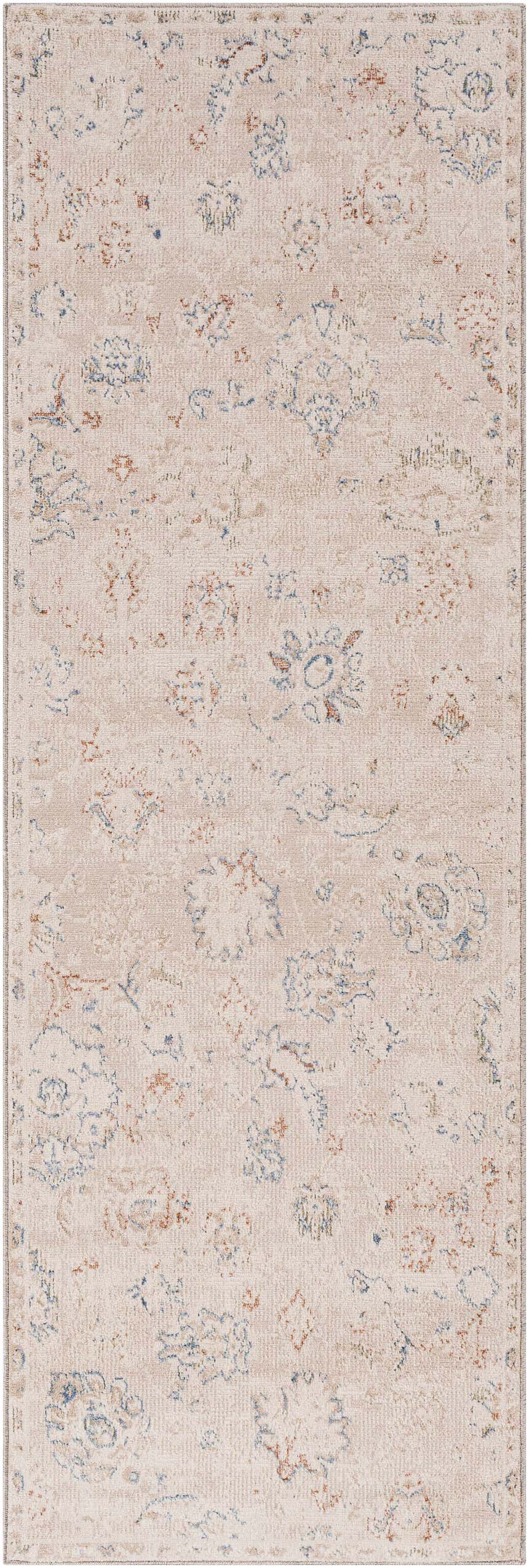 Close-up of the Tinampo Area Rug. Bohemian style rug in brick red, cream, and denim floral pattern. Machine woven polyester. Design-Runner-268