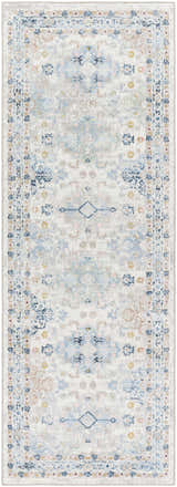 Close-up of Tana Washable Area Rug in Arctic Stone, featuring a traditional, farmhouse-style pattern in blues, grays, and creams. Design-Runner-2773