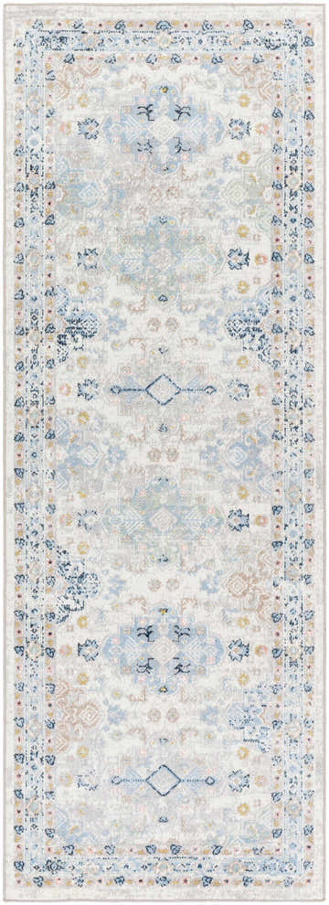 Close-up of Tana Washable Area Rug in Arctic Stone, featuring a traditional, farmhouse-style pattern in blues, grays, and creams. Design-Runner-2773