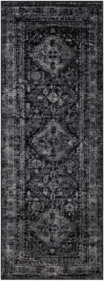 Close-up of the Toni Area Rug in black and gray. Traditional farmhouse style with a distressed, vintage-inspired pattern. Design-Runner-2773