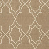 Close-up of the Toledo Area Rug showing a beige background with a light beige quatrefoil pattern. Swatch