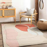 Living room scene with a Tomingad Area Rug featuring geometric shapes in brick red, dusty pink, and oatmeal. Mid-century modern style. Roomscene-Rectangle