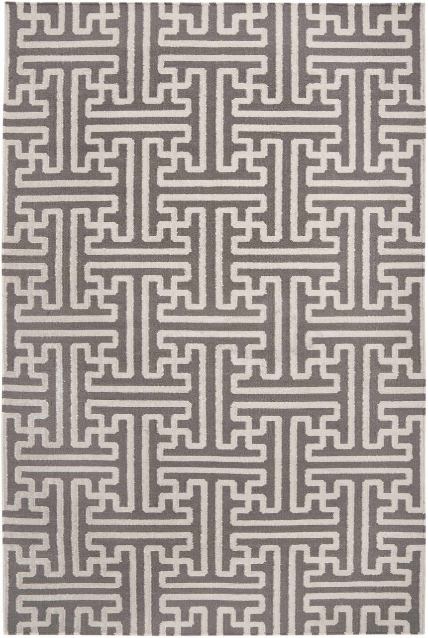 Close-up of the hand woven Tooele Area Carpet. Cream and tan wool rug with a geometric T-shaped pattern. Design-Rectangle