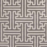 Close-up of the Tooele Area Carpet showing a cream geometric pattern on a tan, hand-woven wool texture. Swatch