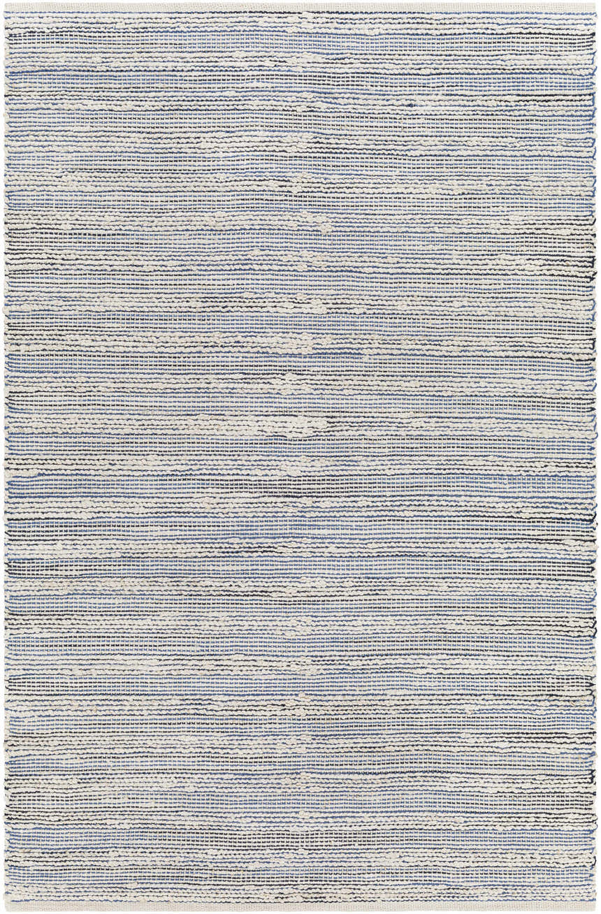 Close-up of the hand woven Totolan Area Rug. Jute rug in beige, denim, and black stripes. Coastal Grandmother style. Design-Rectangle-576