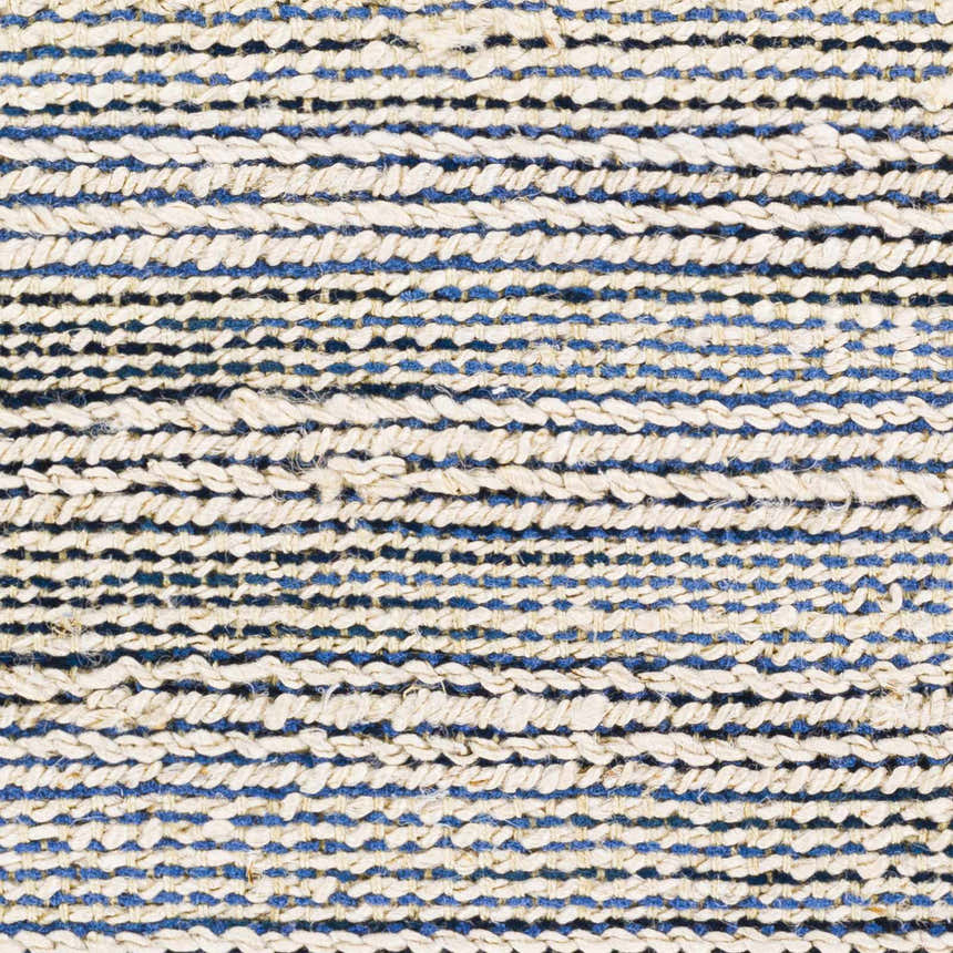 Close-up of hand-woven Totolan Area Rug. Beige jute and denim blue stripes create a textured, coastal design. Swatch