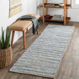 Entryway with Totolan Area Rug runner in beige and denim, styled with a wooden bench, blanket, and plant. Roomscene-Runner
