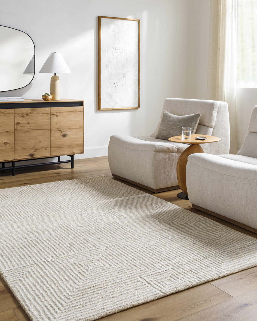 Living room scene with ash and off white Tyrus area rug, wood cabinet, and neutral chairs. Roomscene-Rectangle