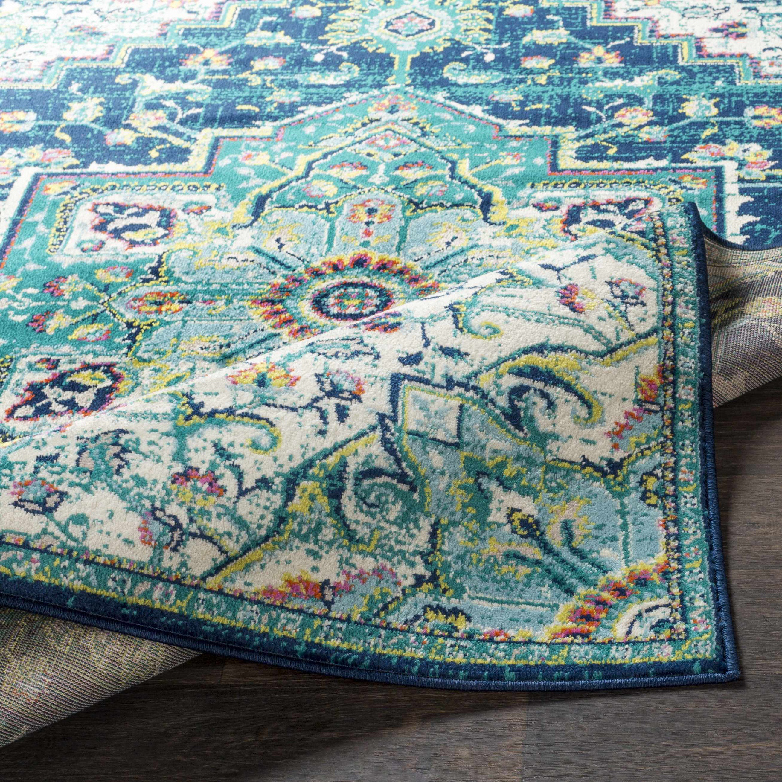 Folded section of Trebloc Area Rug - Clearance, displaying material thickness and weave. Traditional Area Rug Backing  