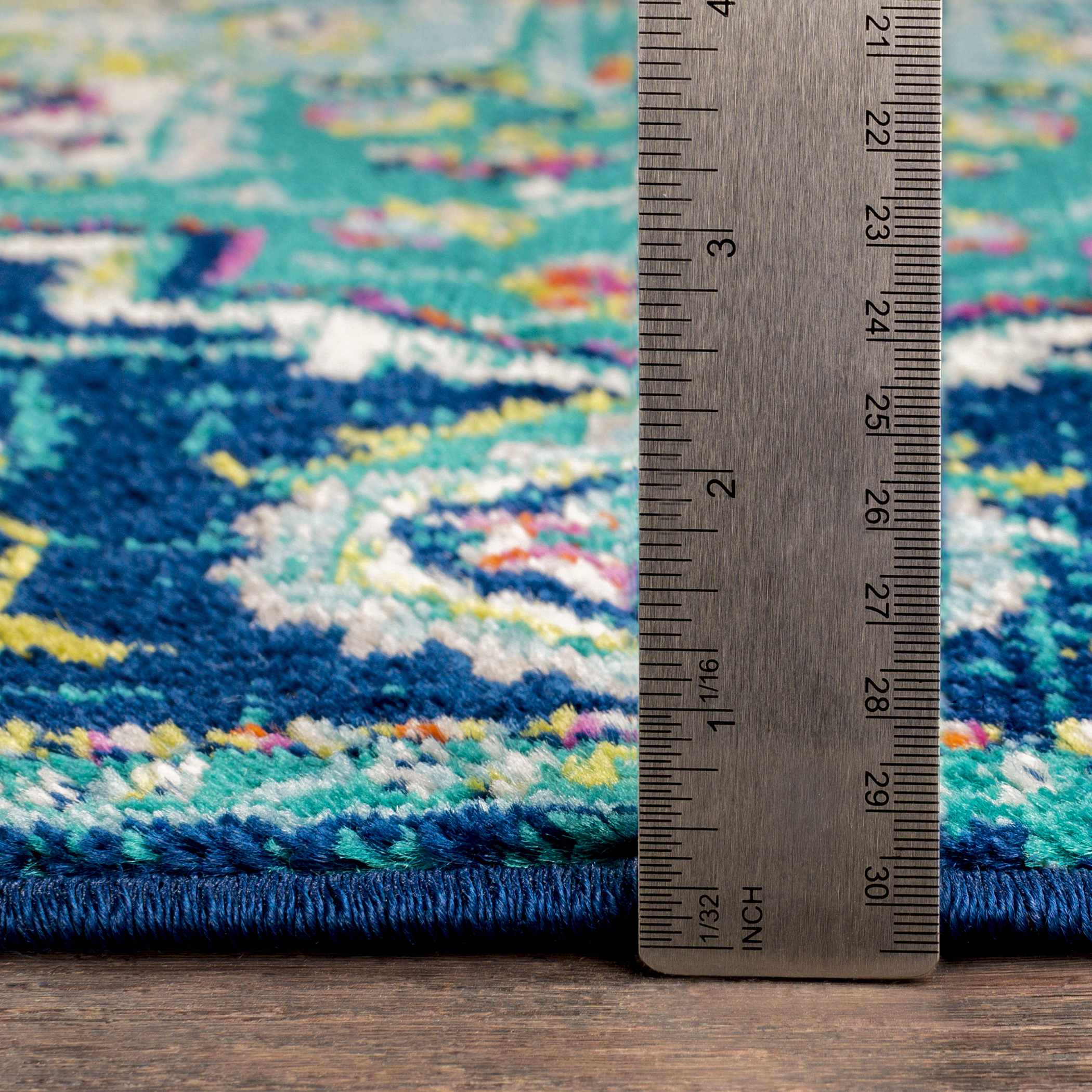 Detailed look at the pile on Trebloc Area Rug - Clearance, showcasing its softness and plushness. Traditional Area Rug Backing  