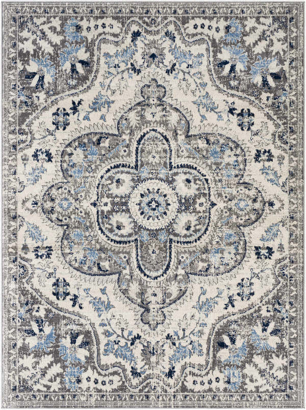 Close-up of the Treharris Area Rug, a machine-woven rug with a traditional floral pattern in charcoal, ivory, and pale blue. Design-Rectangle-537