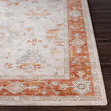 Close-up of the Tsawwassen Thick Luxe Area Rug showing brick red, beige, and blue traditional patterns. Front