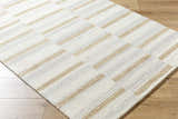 Close-up of Toren Broken-Striped Area Rug. Ash, pearl, and prairie dust stripes on a hand-tufted wool rug with a farmhouse style. Corner