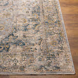 Close-up of the Tuganay Luxe Performance Rug. Beige, blue, and mustard tones in a traditional, distressed pattern. Front