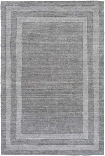Close-up of the gray Turbotville Area Rug, a hand-tufted wool rug with a solid striped border design. Design-Rectangle-576
