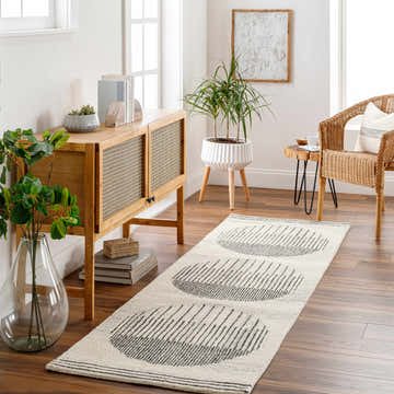 Entryway with wood floors and a Turgut Modern Wool Rug runner with black circle design. Roomscene-Runner