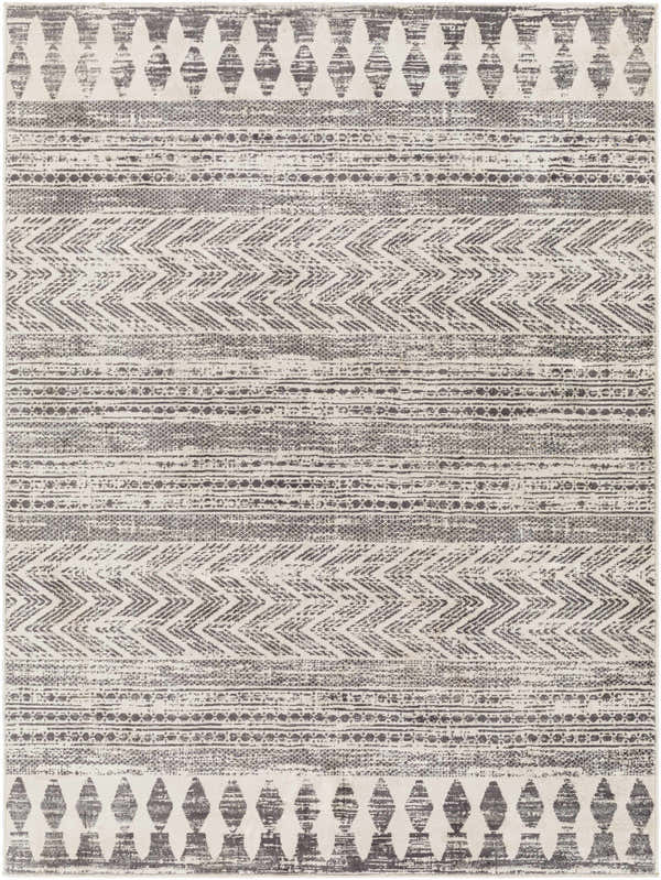 Close-up of the Tuy Area Rug. Bohemian style rug with dark gray, light gray, and nutmeg geometric patterns. Design-Rectangle-537
