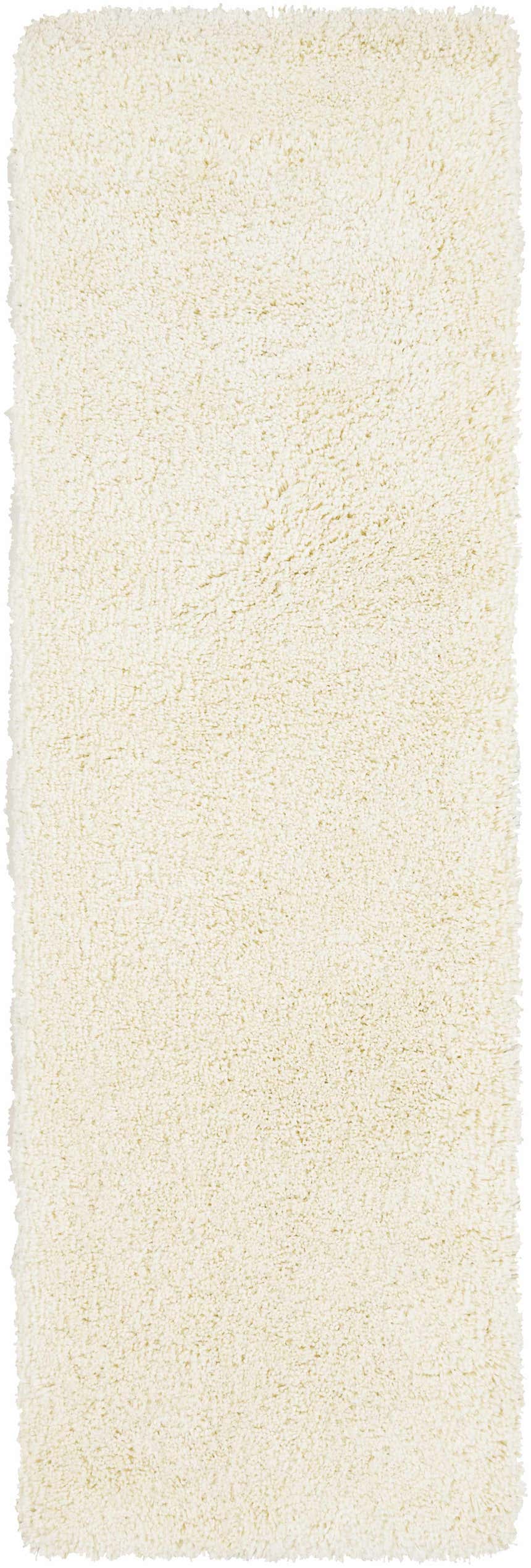 Close-up of the cream Umpire Area Rug. Hand woven shag rug with a soft, textured pile. Design-Runner-268